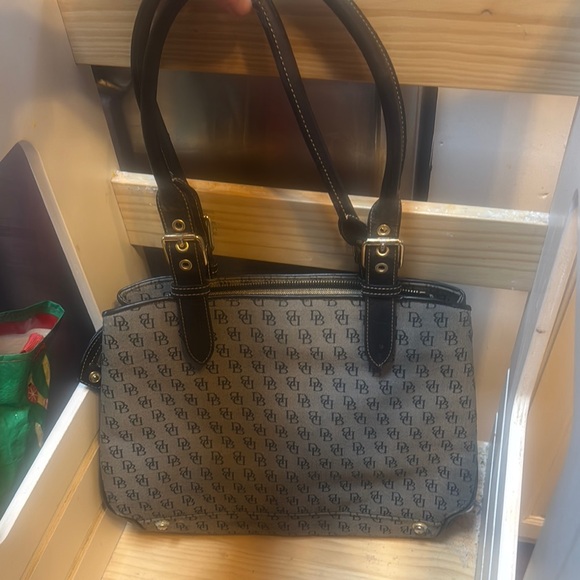 Dooney and Bourke Purse some staining in middle of purses
Monogram Handbag - Picture 3 of 6